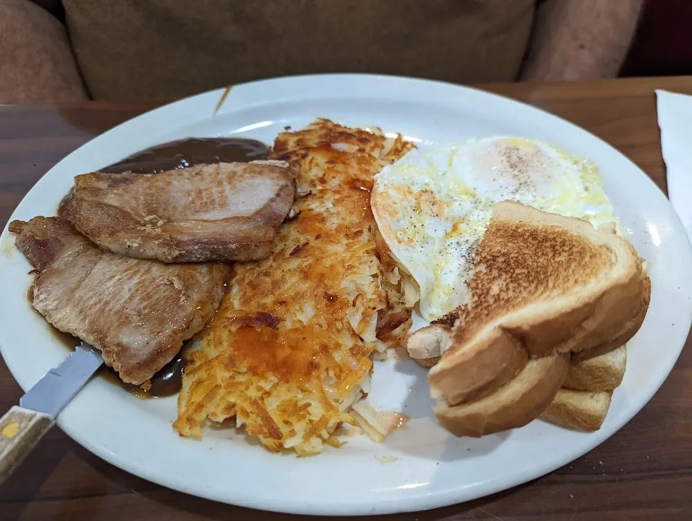 Double Pork Chop Hash Brown and Eggs Breakfast